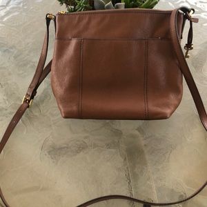 Brown Fossil leather purse.
